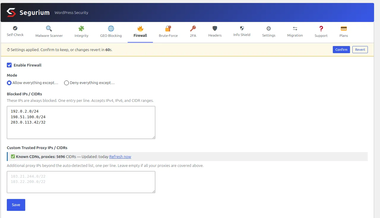 The Firewall tab of a WordPress plugin. A yellow banner across the top reads that settings were applied and revert in 60 seconds, with Confirm and Revert buttons. Below it an Enable Firewall checkbox is ticked, a Mode pair of radio buttons has Allow everything except selected over Deny everything except, and a Blocked IPs slash CIDRs box holds three lines: 192.0.2.0/24, 198.51.100.0/24 and 203.0.113.42/32. Underneath, a status line with a green tick reads Known CDNs, proxies: 5696 CIDRs, updated today, next to a Refresh now link, above an empty custom trusted proxy box and a Save button.